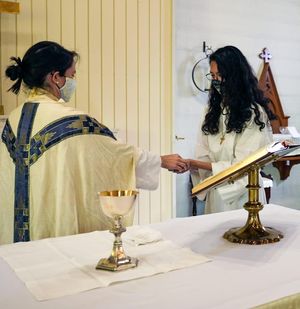 Two students perform ceremony.