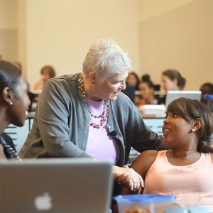A faculty member connects with a student.
